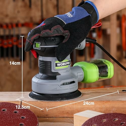 Person using an electric sander on wood.